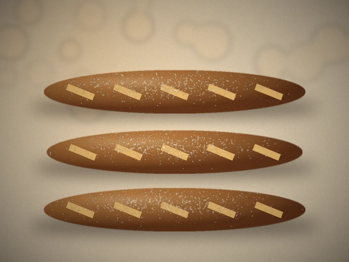 Baguettes cooling on a rack after baking