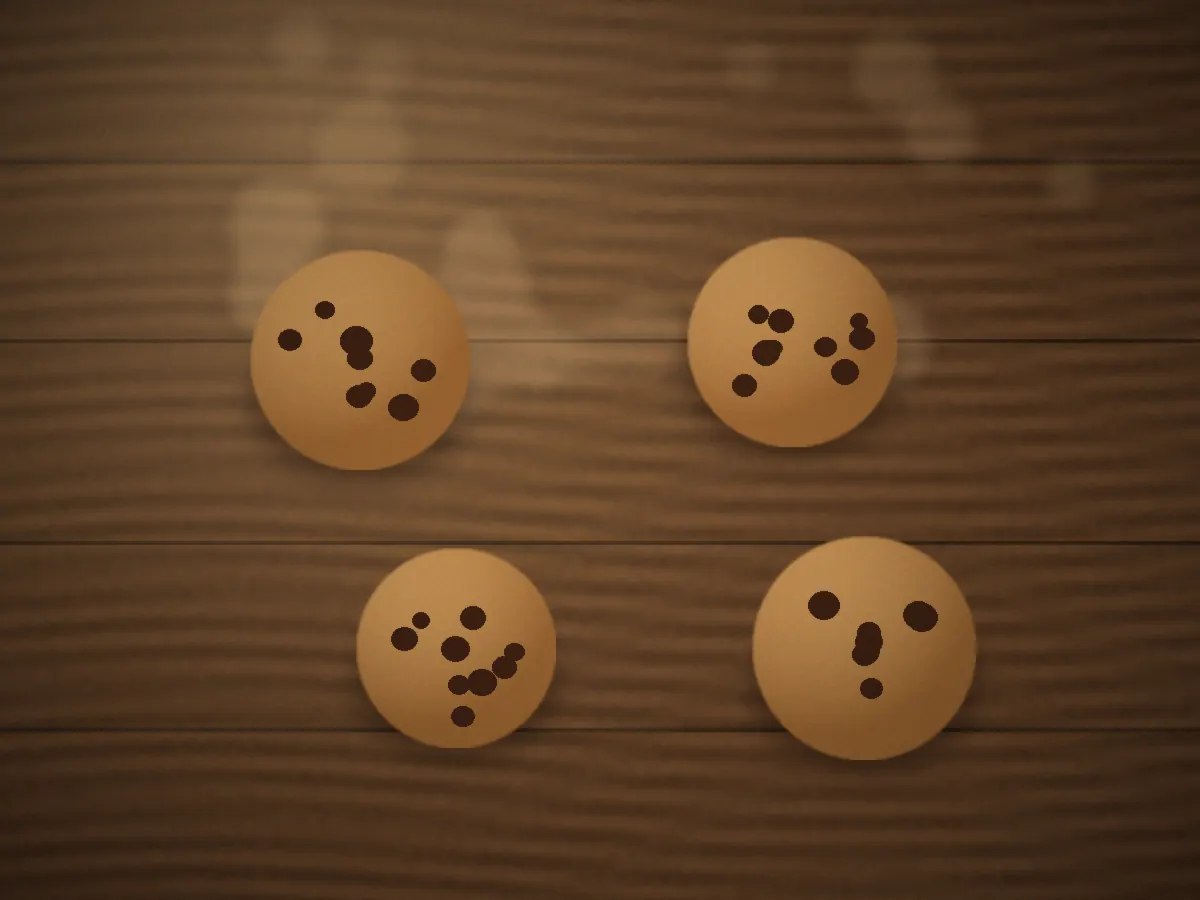 Chocolate chunk cookies with crisp edges arranged on a wooden board